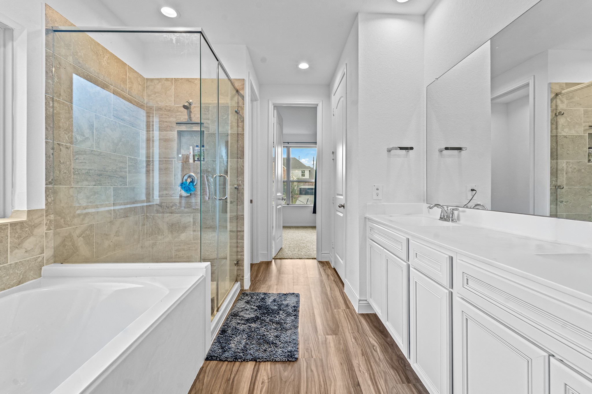 15814 Gibson Grass Court Spring, TX 77379 - Photo 14 of 26 a spacious bathroom with a tub shower and sink