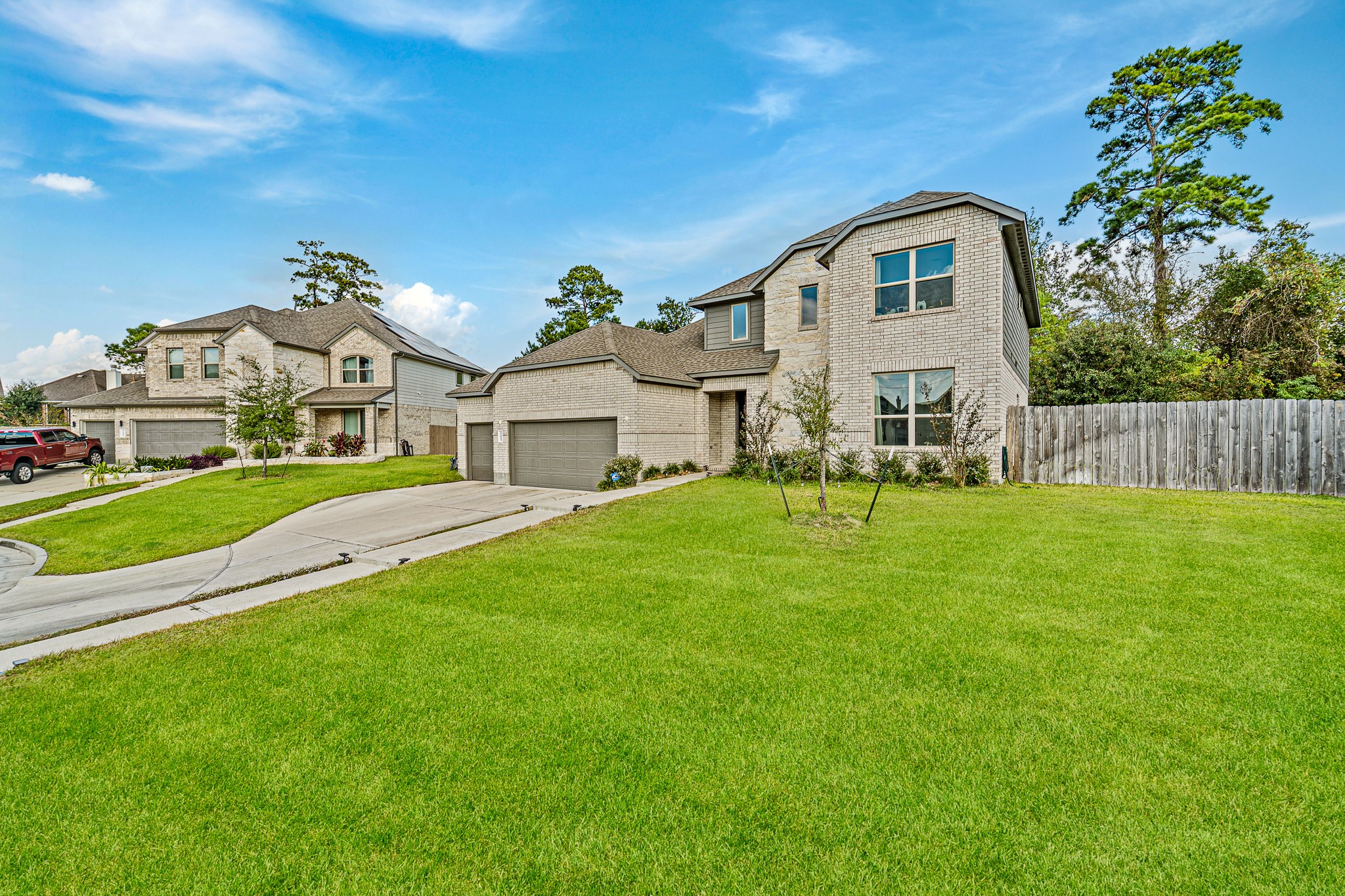 15814 Gibson Grass Court Spring, TX 77379 - Photo 2 of 26 a front view of a house with a garden and yard