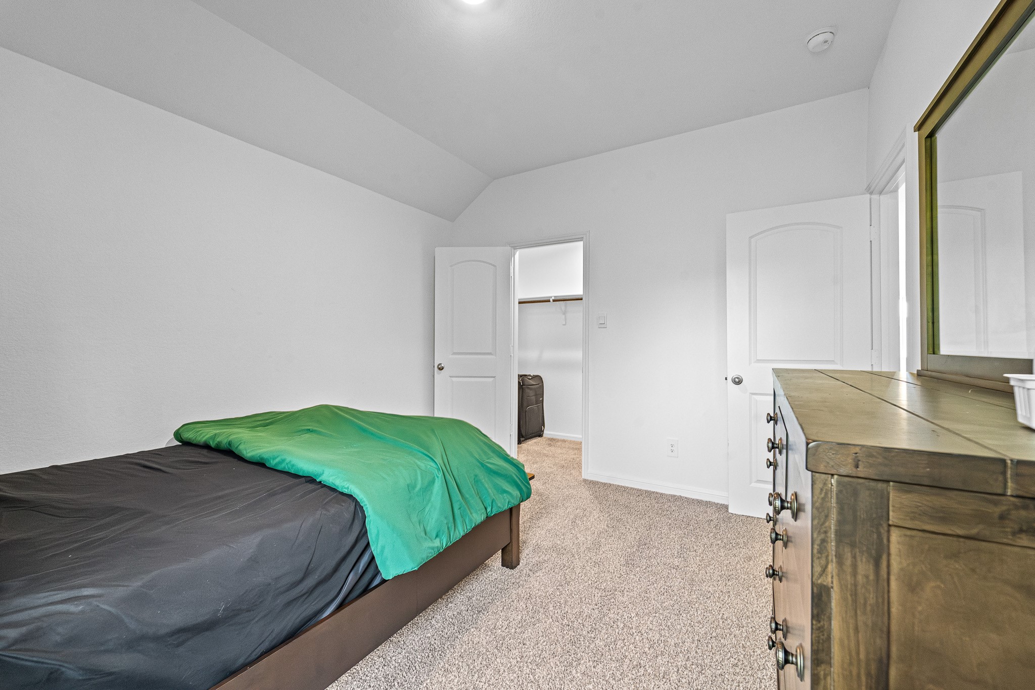 15814 Gibson Grass Court Spring, TX 77379 - Photo 22 of 26 a bedroom with a bed and a desk