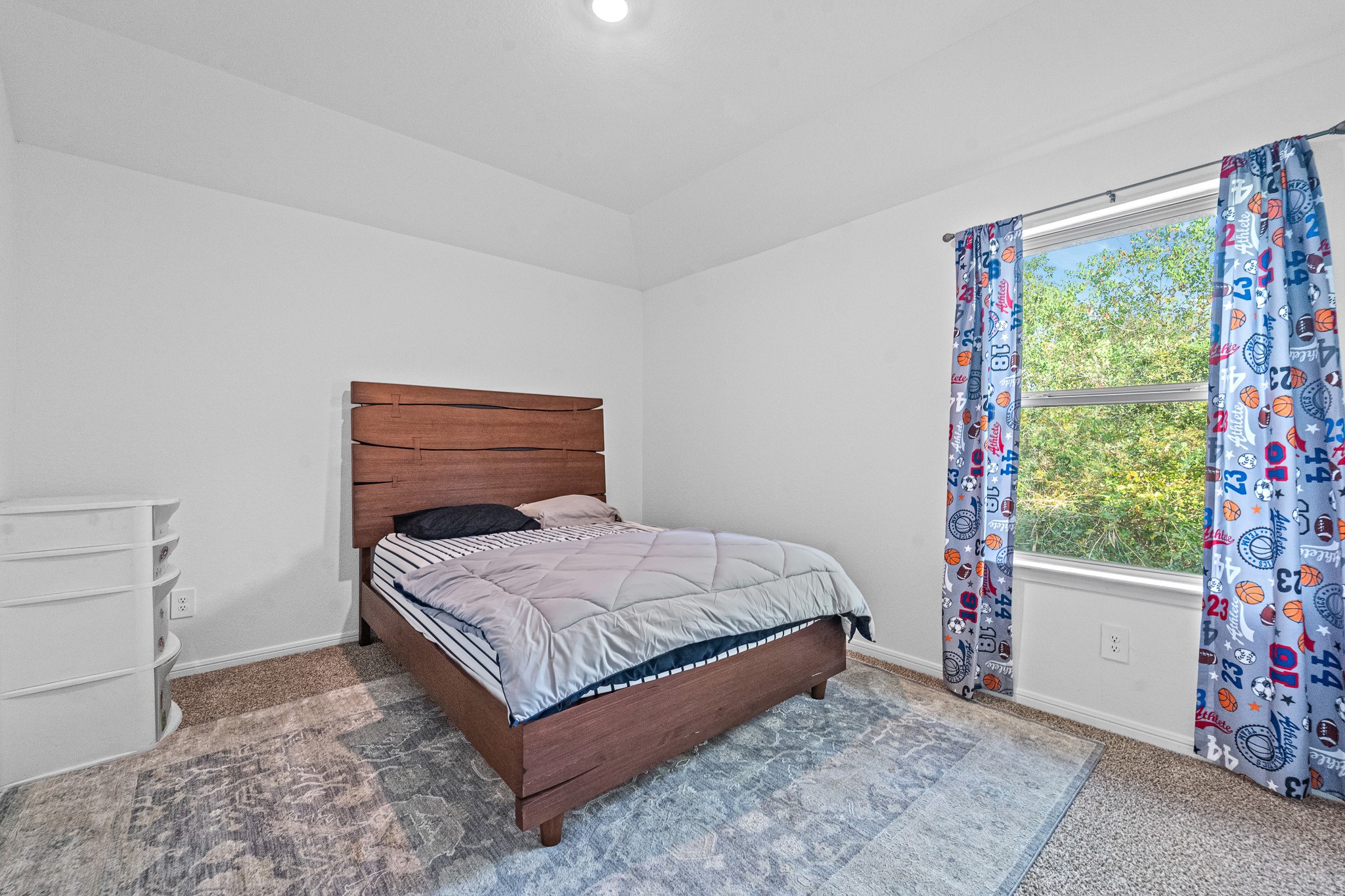 15814 Gibson Grass Court Spring, TX 77379 - Photo 23 of 26 a bedroom with a bed and a window