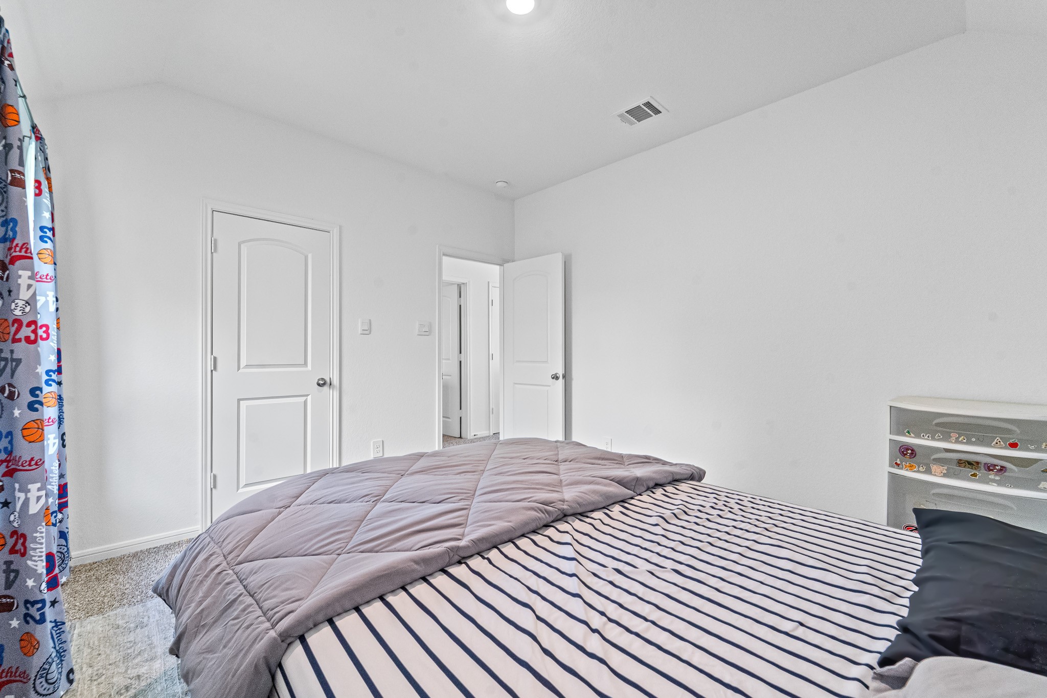 15814 Gibson Grass Court Spring, TX 77379 - Photo 24 of 26 a bedroom with a bed and a book shelf