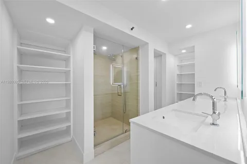 a bathroom with a sink and mirror