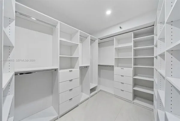 a view of an empty walk in closet