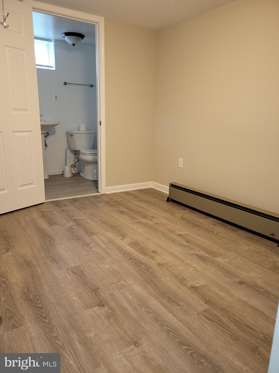 11803 Rocking Horse Road Rockville, MD 20852 - Photo 26 of 28 a view of empty room with wooden floor