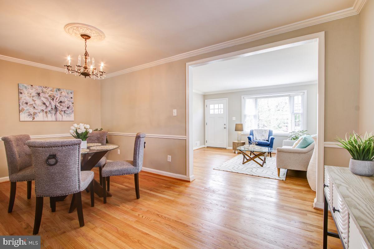 11803 Rocking Horse Road Rockville, MD 20852 - Photo 5 of 28 a view of a dining room with furniture window and wooden floor