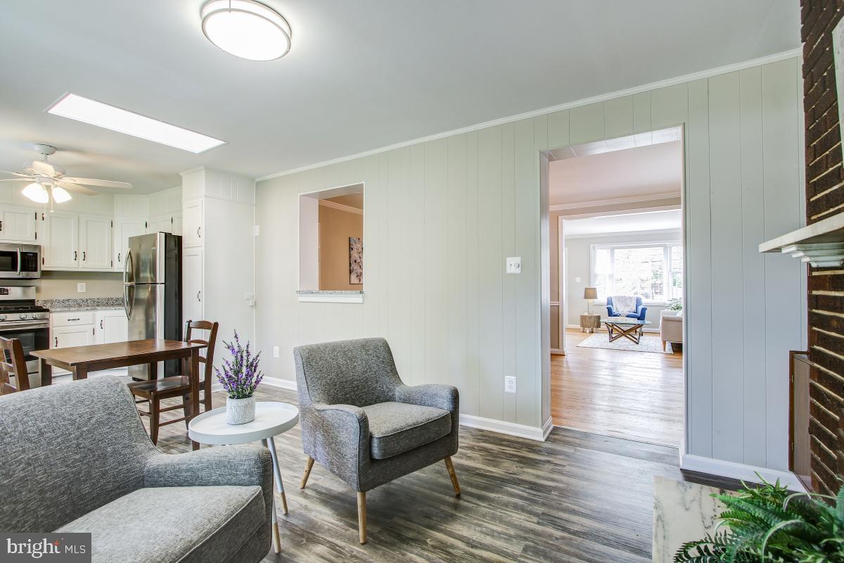 11803 Rocking Horse Road Rockville, MD 20852 - Photo 8 of 28 a living room with furniture and wooden floor