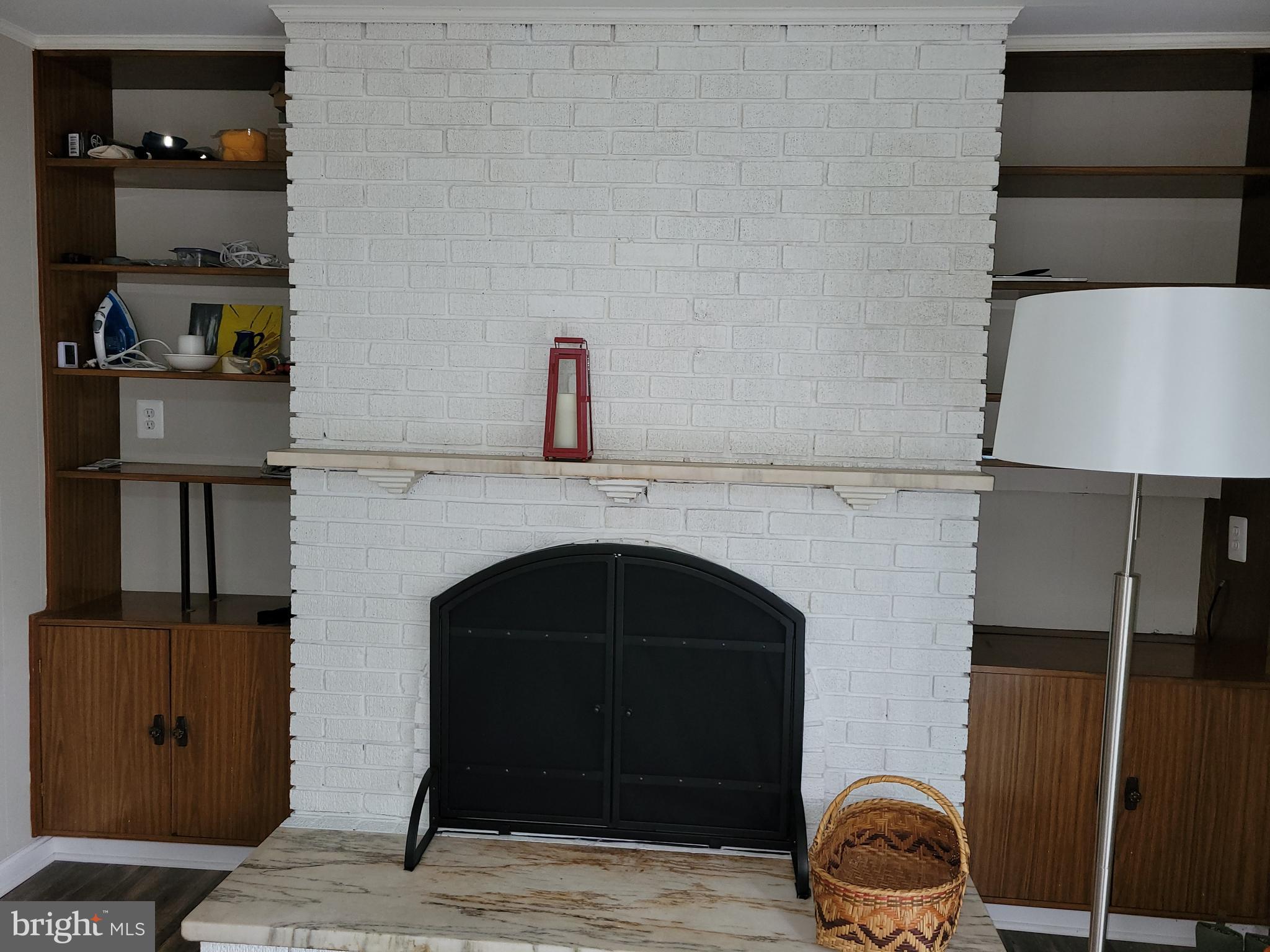11803 Rocking Horse Road Rockville, MD 20852 - Photo 9 of 28 a living room with furniture and a fireplace