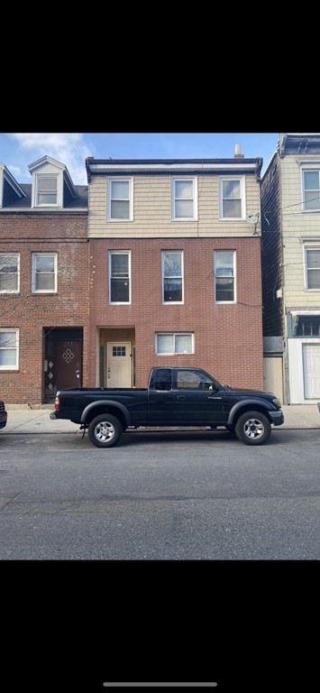 306 Sumner Street Boston, MA 02128 - Photo 3 of 7 a view of a car parked in front of a building