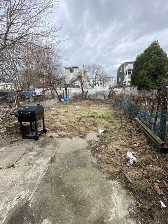 306 Sumner Street Boston, MA 02128 - Photo 6 of 7 a view of outdoor space with garden and barbeque oven