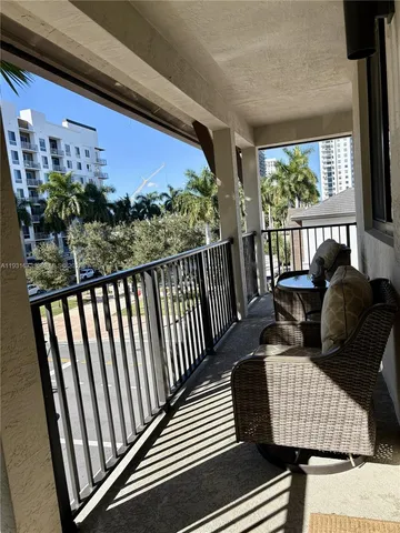 a bathroom with a sink mirror vanity and toilet