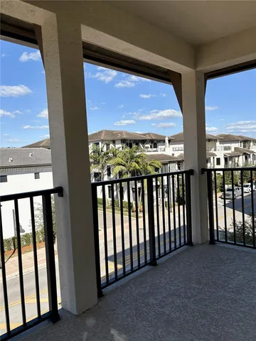 a view of a hallway with stairs