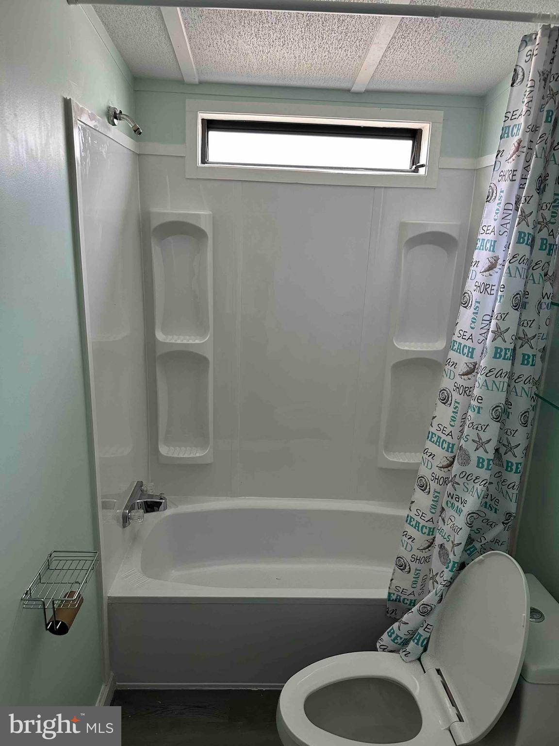 8353 Ashwood Road, Unit 8353 Jessup, MD 20794 - Photo 6 of 11 a bathroom with a toilet and a bathtub