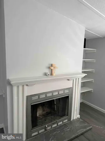 a stove top oven sitting inside of a kitchen