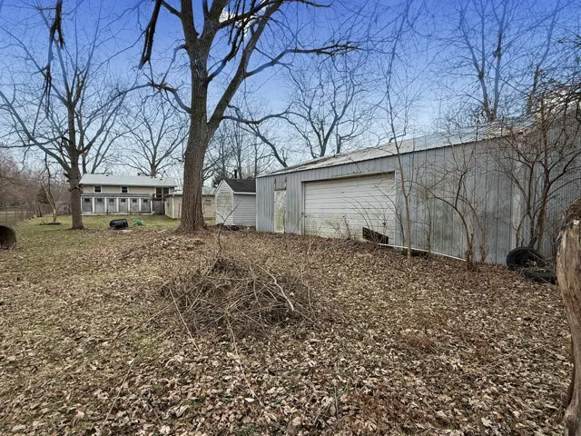 a backyard of a house with large trees