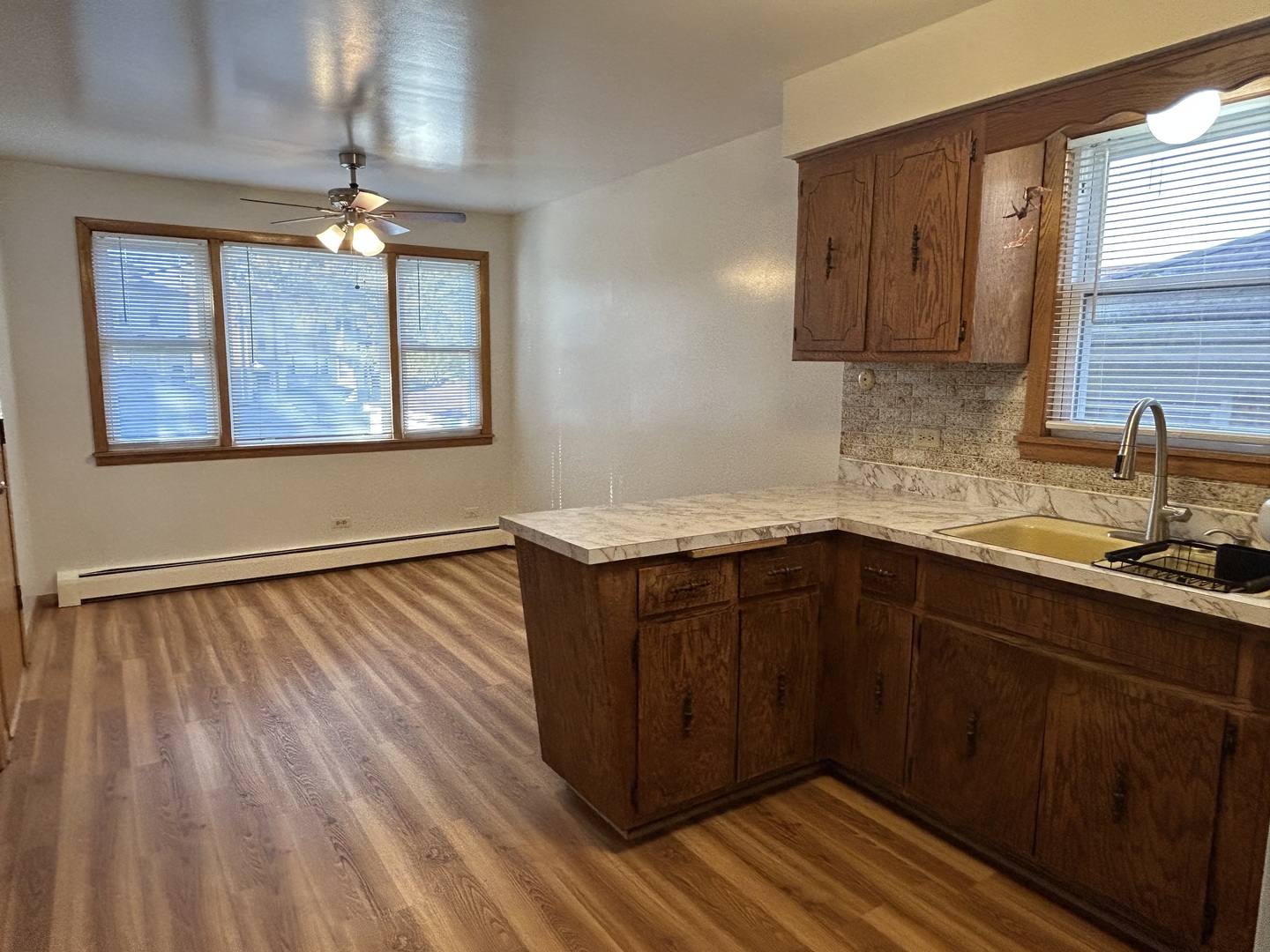 5350 North Central Avenue, Unit 1 Chicago, IL 60630 - Photo 20 of 24 a kitchen with wooden cabinets and window
