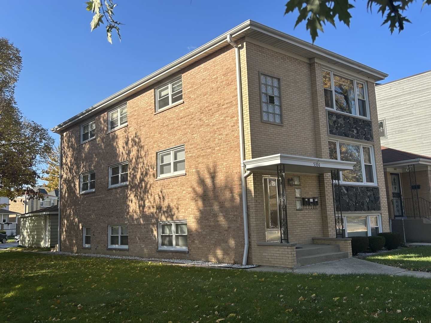 5350 North Central Avenue, Unit 1 Chicago, IL 60630 - Photo 2 of 24 a front view of house with yard