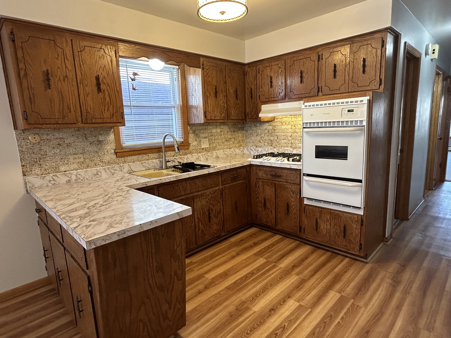 5350 North Central Avenue, Unit 1 Chicago, IL 60630 - Photo 21 of 24 a kitchen with stainless steel appliances granite countertop a sink stove and refrigerator