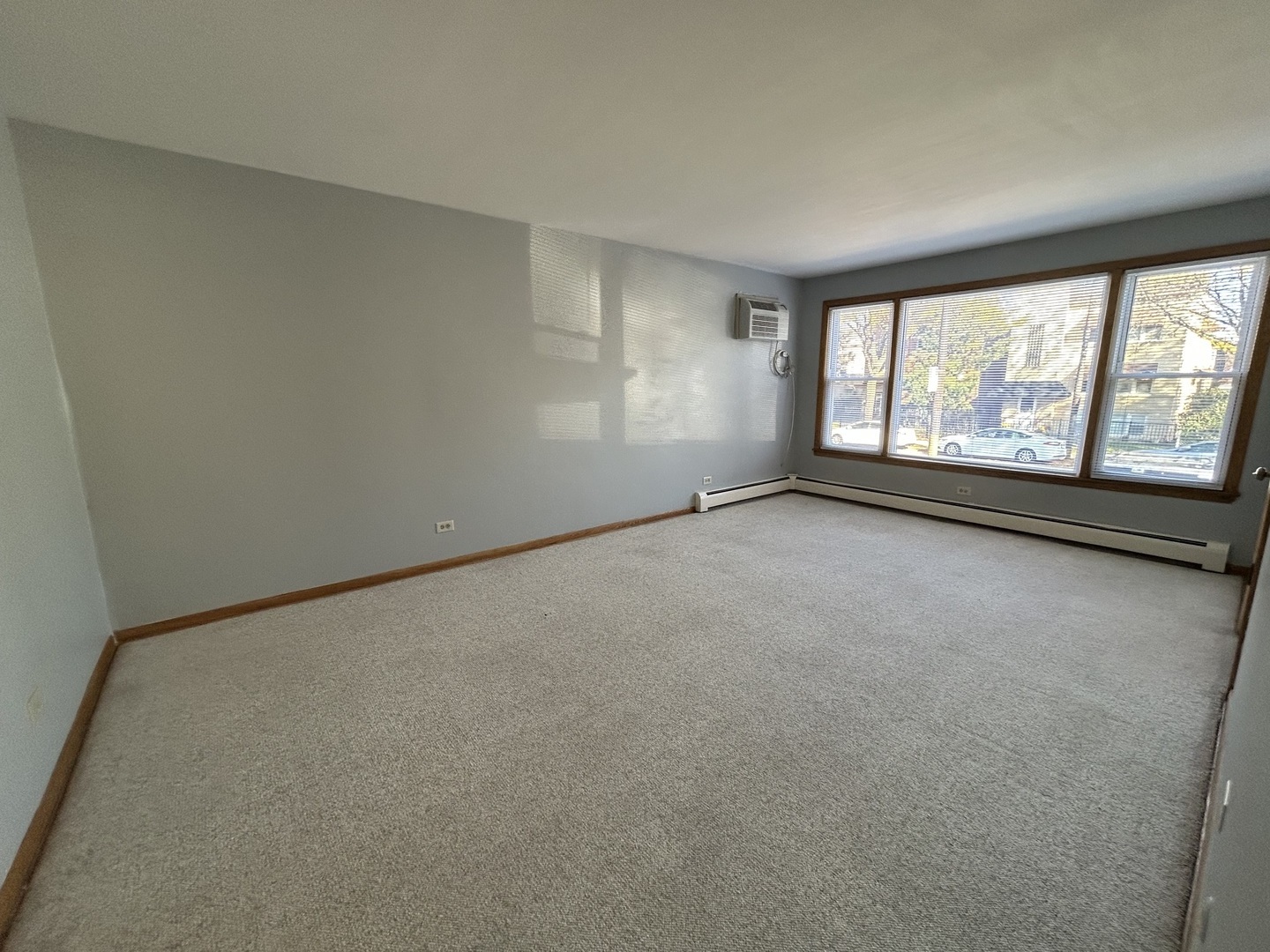 5350 North Central Avenue, Unit 1 Chicago, IL 60630 - Photo 3 of 24 an empty room with windows