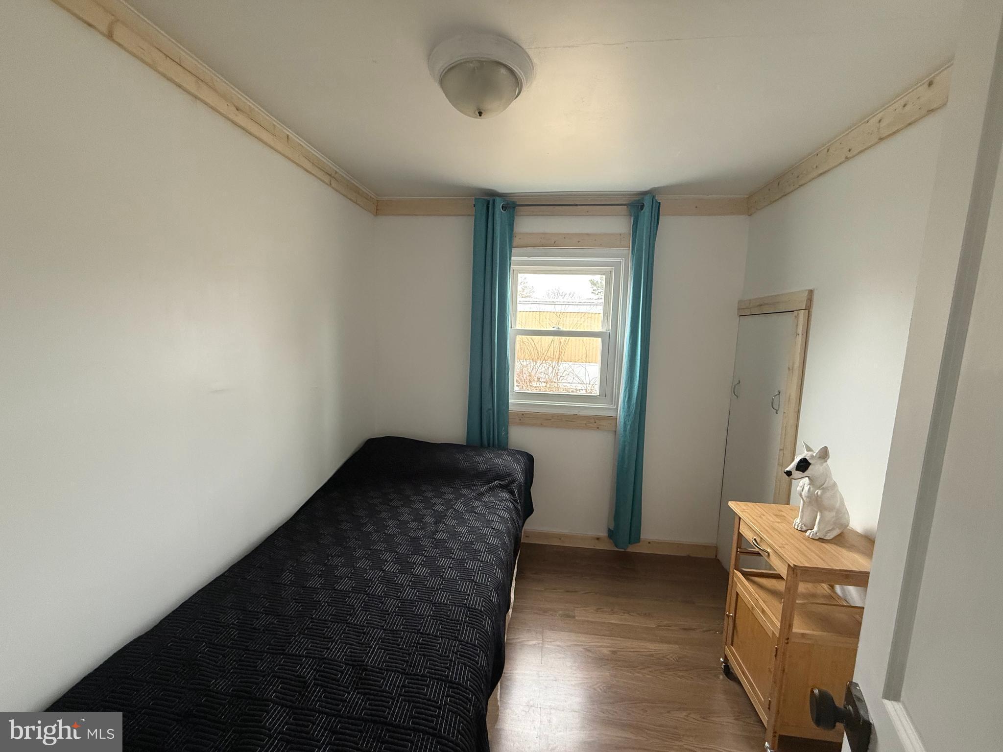 33987 Sunflower Road, Unit 3831 Lewes, DE 19958 - Photo 12 of 17 a bedroom with a bed and a window