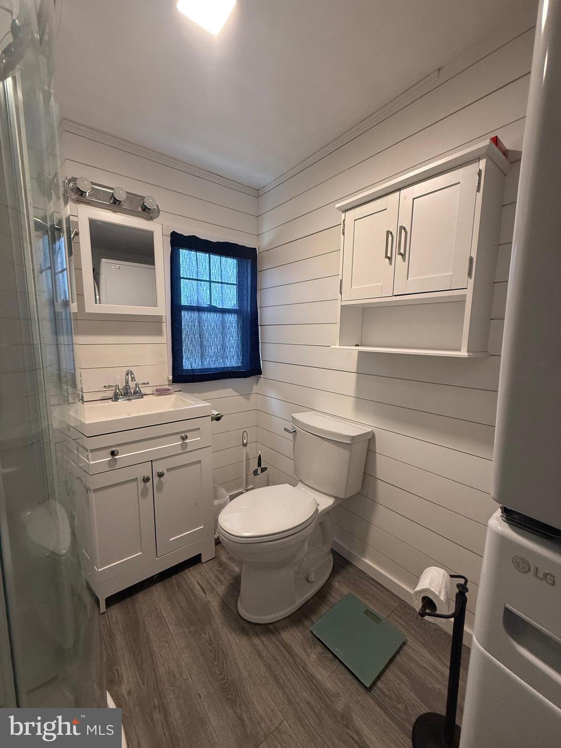 33987 Sunflower Road, Unit 3831 Lewes, DE 19958 - Photo 13 of 17 a bathroom with a toilet sink and mirror