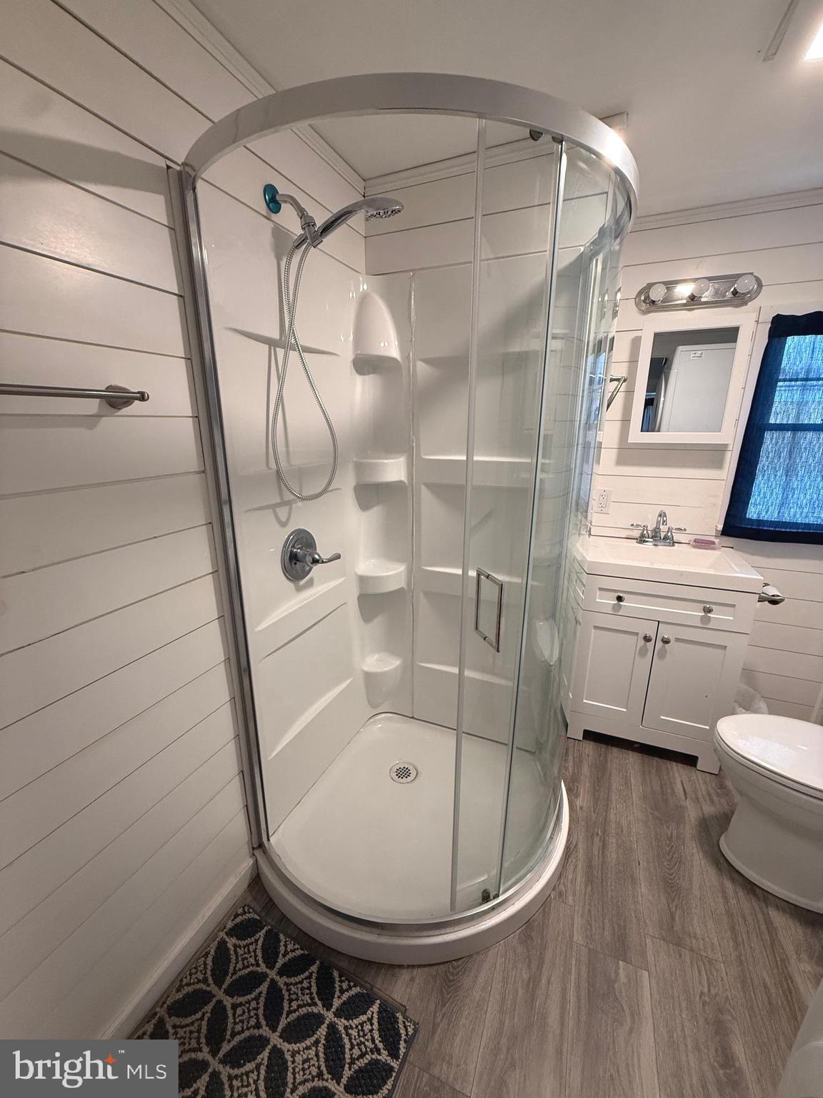 33987 Sunflower Road, Unit 3831 Lewes, DE 19958 - Photo 14 of 17 a bathroom with a sink toilet and shower