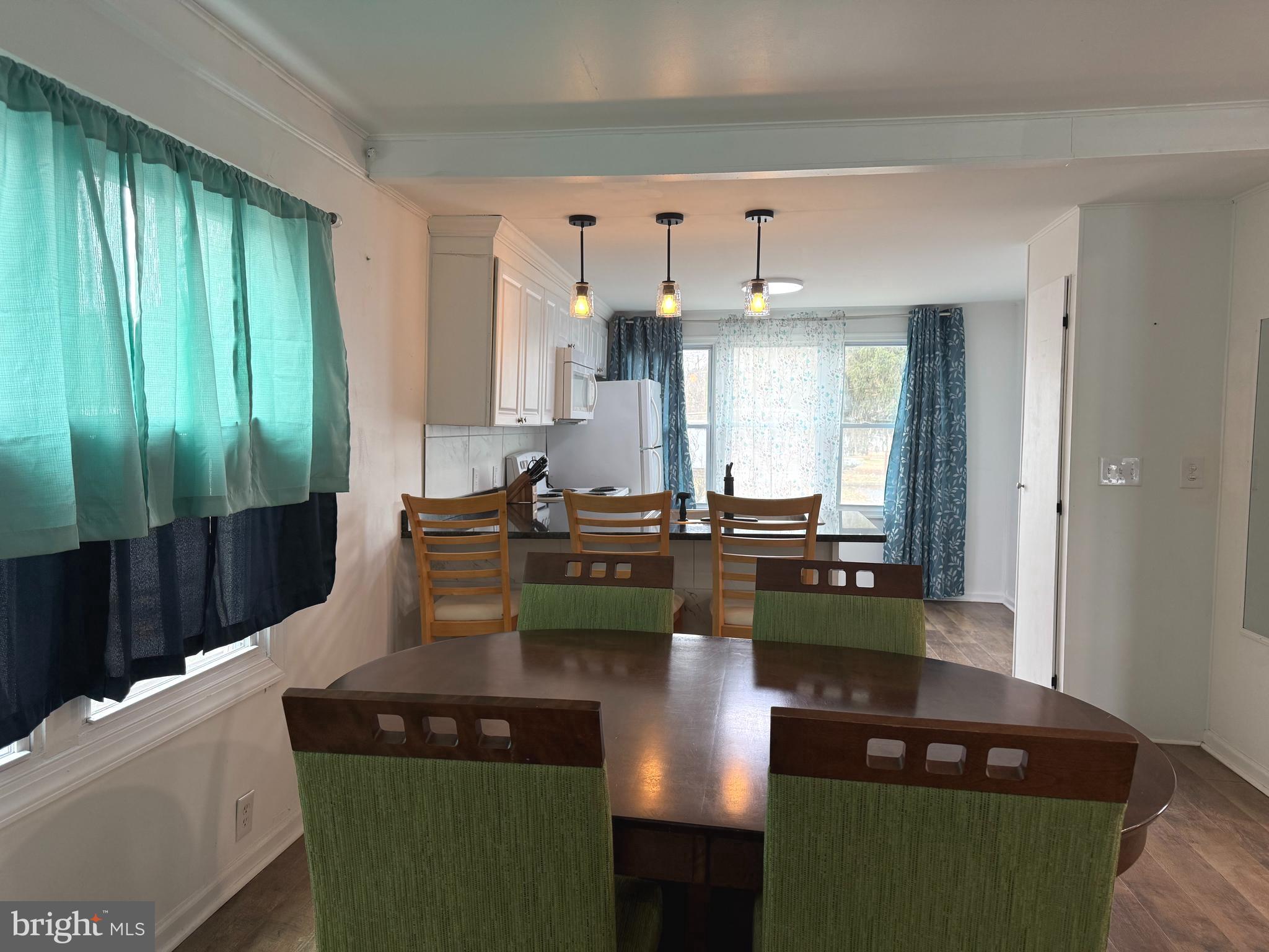 33987 Sunflower Road, Unit 3831 Lewes, DE 19958 - Photo 5 of 17 a kitchen with a table and chairs