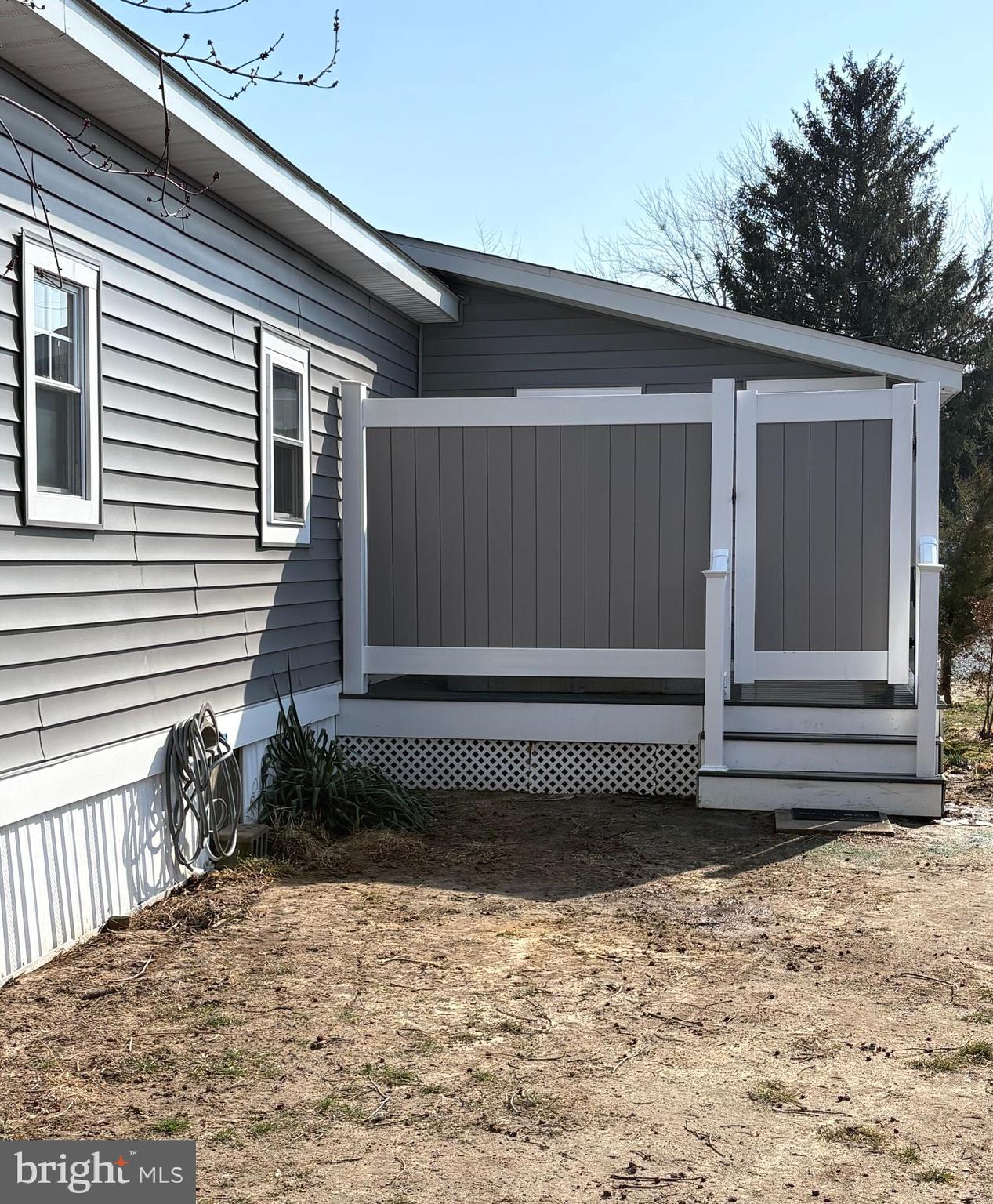 33987 Sunflower Road, Unit 3831 Lewes, DE 19958 - Photo 7 of 17 a view of a house with a yard