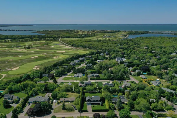 a view of a field with an ocean