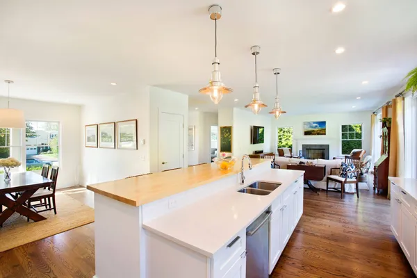 a very nice looking living room with dining room and wooden floor