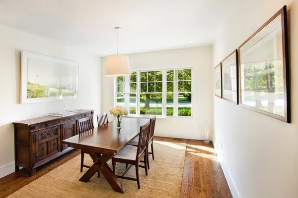 a view of a dining room with furniture window and outside view