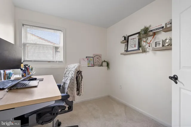 a room with a window and gym equipment