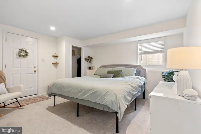 a bedroom with a bed and a couch