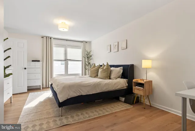 a bedroom with bed and window