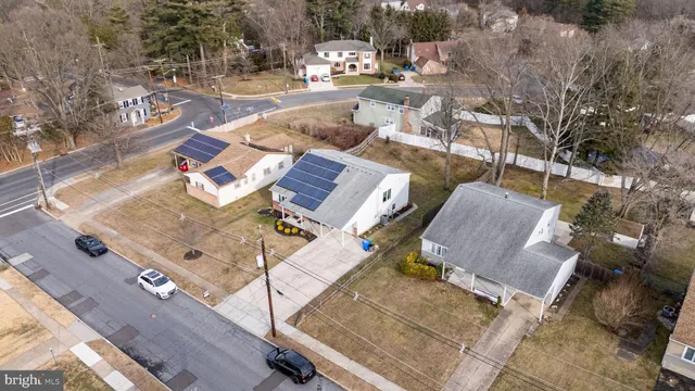 an aerial view of a house with garden space and sitting space