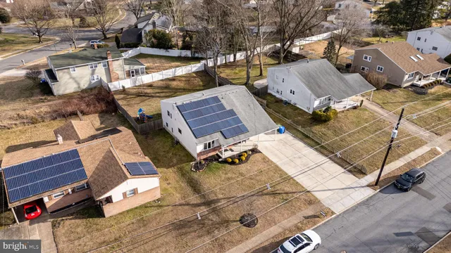 an aerial view of a house with outdoor space