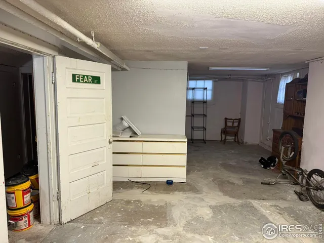 a view of room with furniture and closet