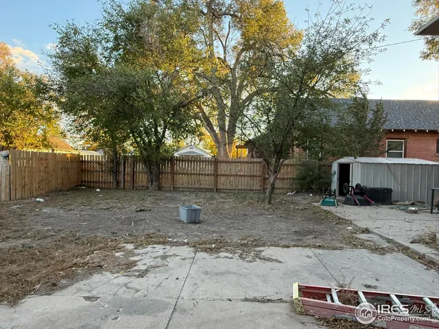 a backyard of a house with trampoline