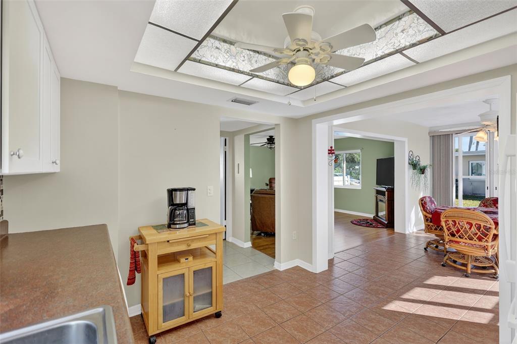 14 Strathmore Boulevard, Unit 14 Sarasota, FL 34233 - Photo 16 of 42 a view of a livingroom with furniture and a ceiling fan
