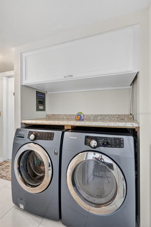 14 Strathmore Boulevard, Unit 14 Sarasota, FL 34233 - Photo 28 of 42 a utility room with dryer and washer