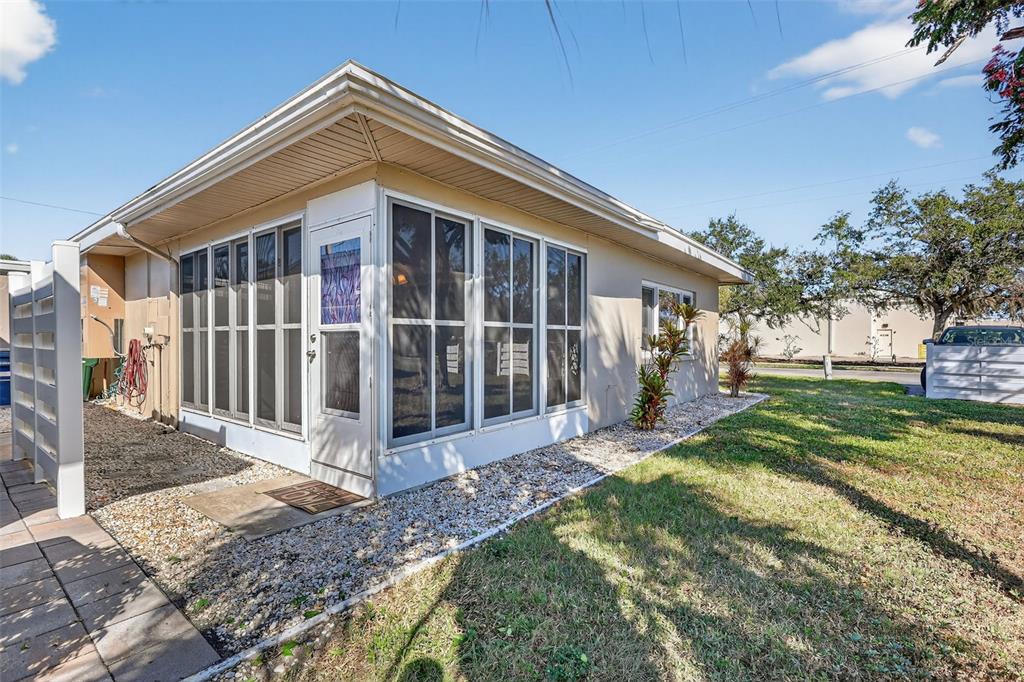 14 Strathmore Boulevard, Unit 14 Sarasota, FL 34233 - Photo 29 of 42 a view of a house with backyard and sitting area