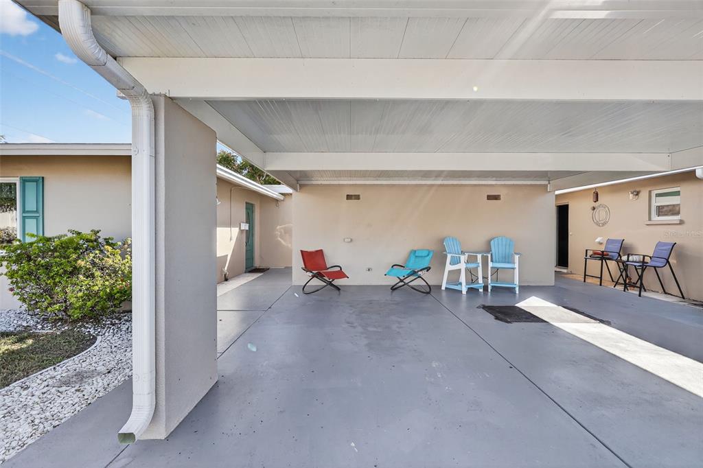 14 Strathmore Boulevard, Unit 14 Sarasota, FL 34233 - Photo 3 of 42 a view of a room with gym equipment
