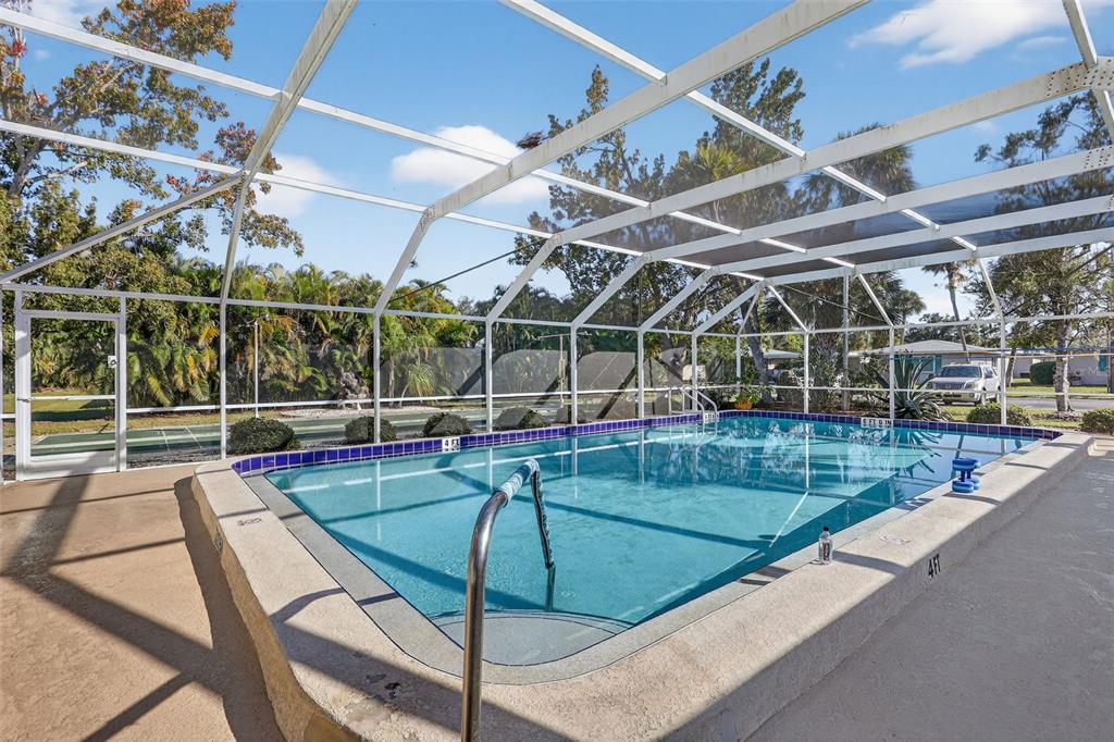 14 Strathmore Boulevard, Unit 14 Sarasota, FL 34233 - Photo 39 of 42 a view of a backyard