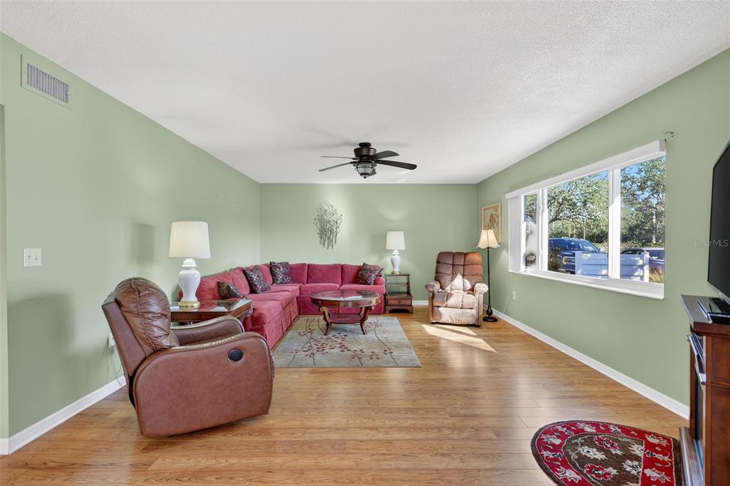 14 Strathmore Boulevard, Unit 14 Sarasota, FL 34233 - Photo 6 of 42 a living room with furniture