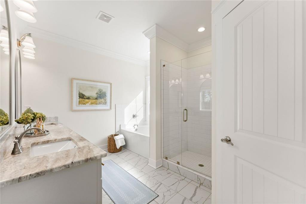 6998 Britt Gailey Road Clermont, GA 30527 - Photo 35 of 92 a bathroom with a granite countertop sink a toilet and shower