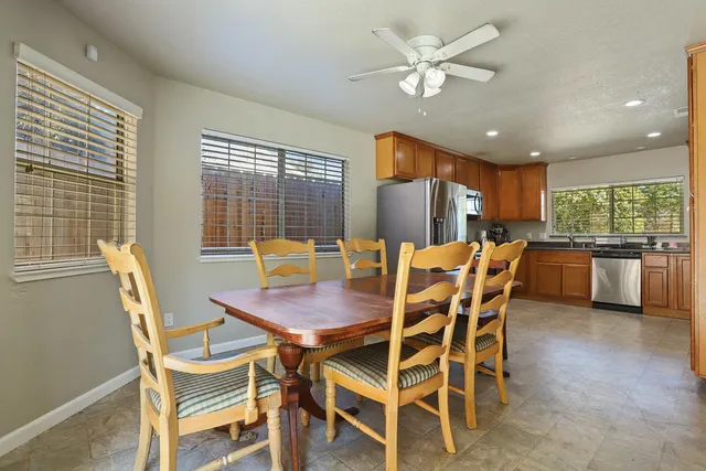 a dining room with furniture and window