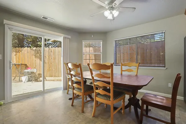 a kitchen with granite countertop stainless steel appliances a refrigerator sink and microwave