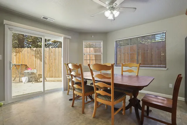 a kitchen with granite countertop stainless steel appliances a refrigerator sink and microwave