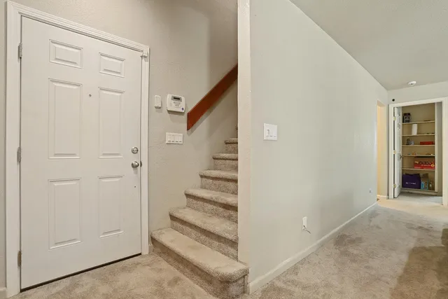 a bedroom with a bed and cabinets