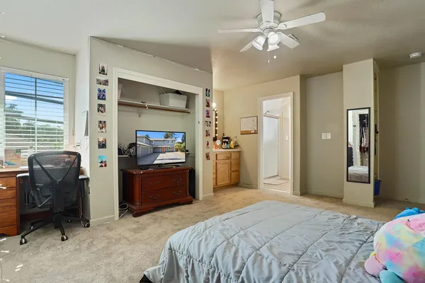 a en suite bathroom with a sink and a mirror