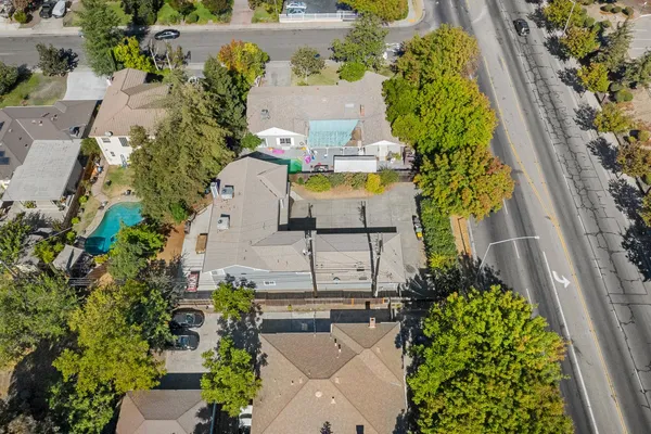 an aerial view of a house with outdoor space